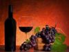 15083217-still-life-with-red-wine-and-grapes-on-warm-background.jpg
